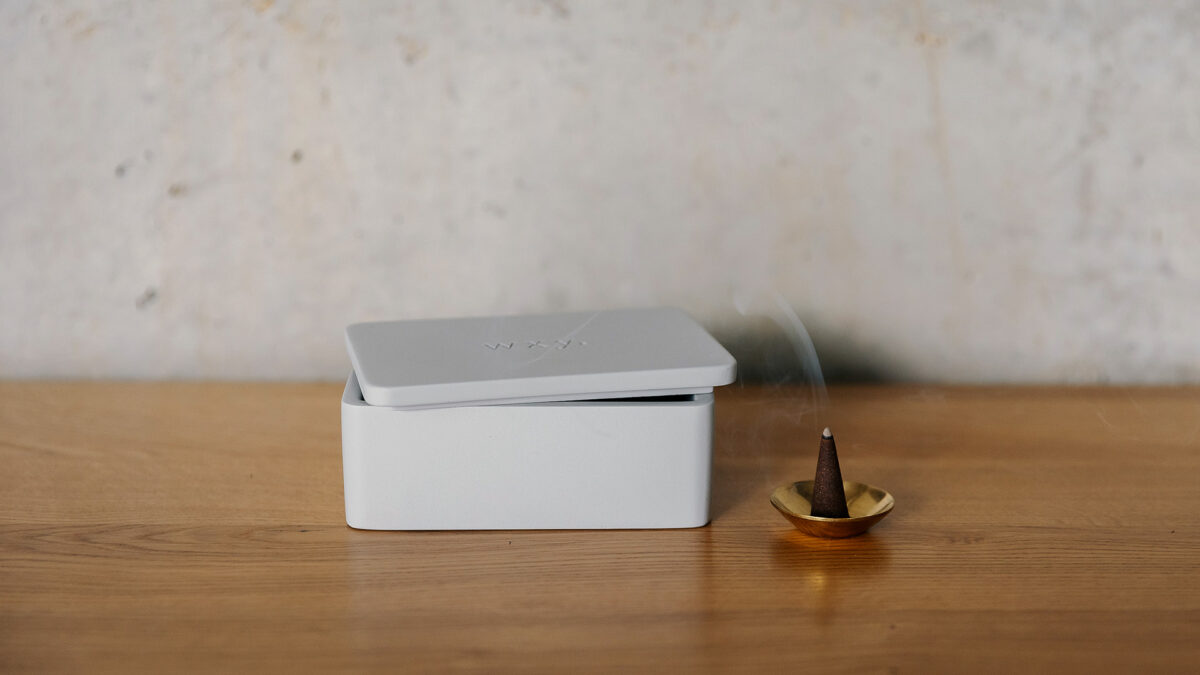 light grey box with incense and holder