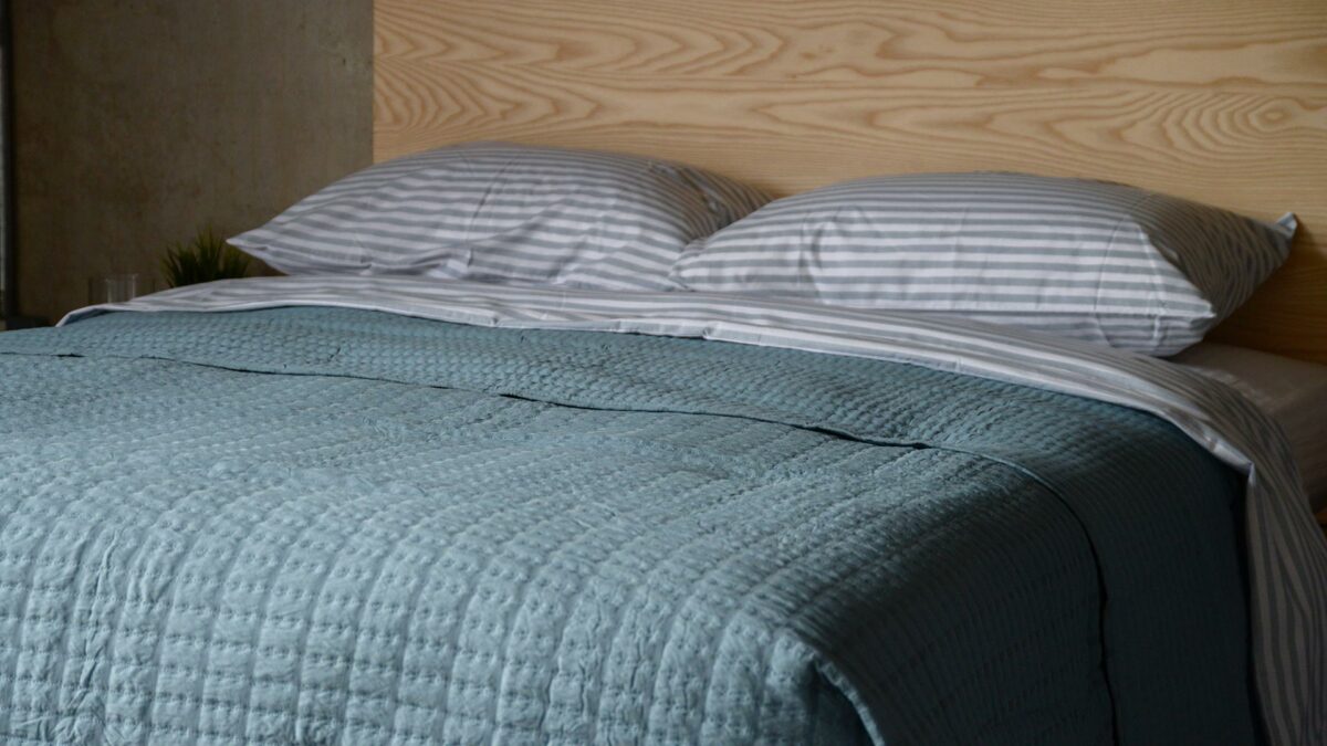 pale teal dimpled ribbon pattern quilted bedspread