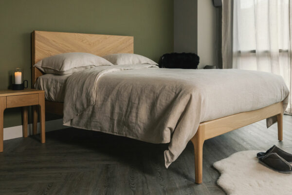 Highbury bed with a tall chevron pattern headboard here in oak