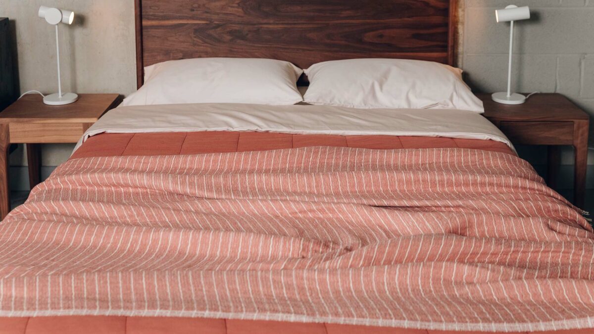 lightweight woven throw in terracotta with an ivory stripe