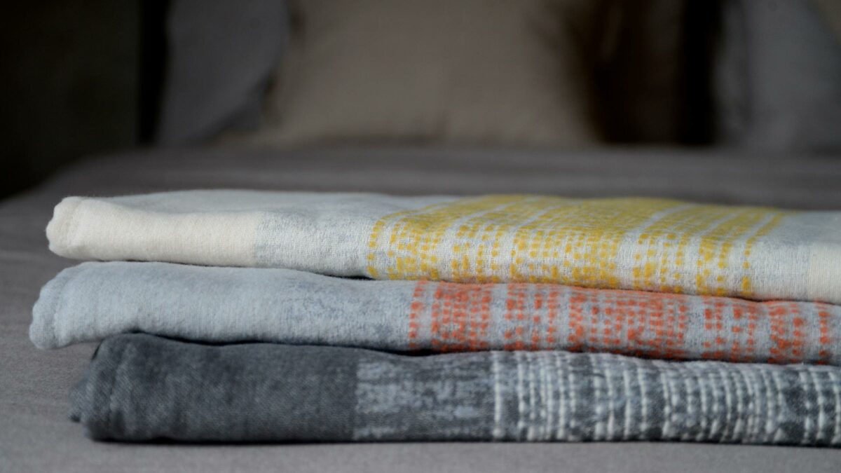 light throws in ivory silver and deep grey
