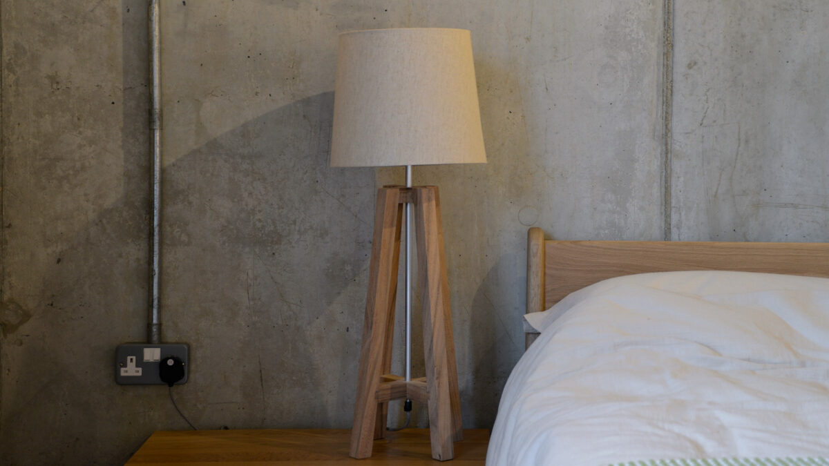 light wood cross base bedside lamp