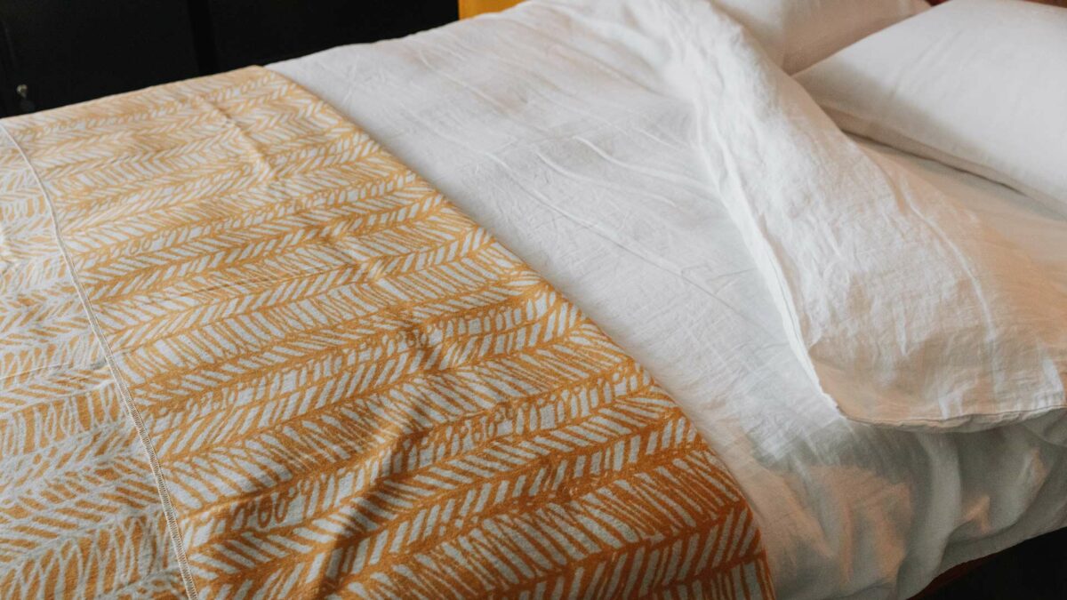 linen bedding and scribble print blanket
