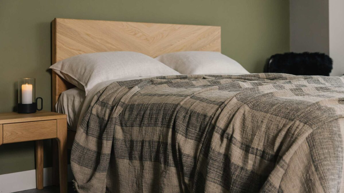 luxurious textured weave bedspread with stripes of taupe and black threads