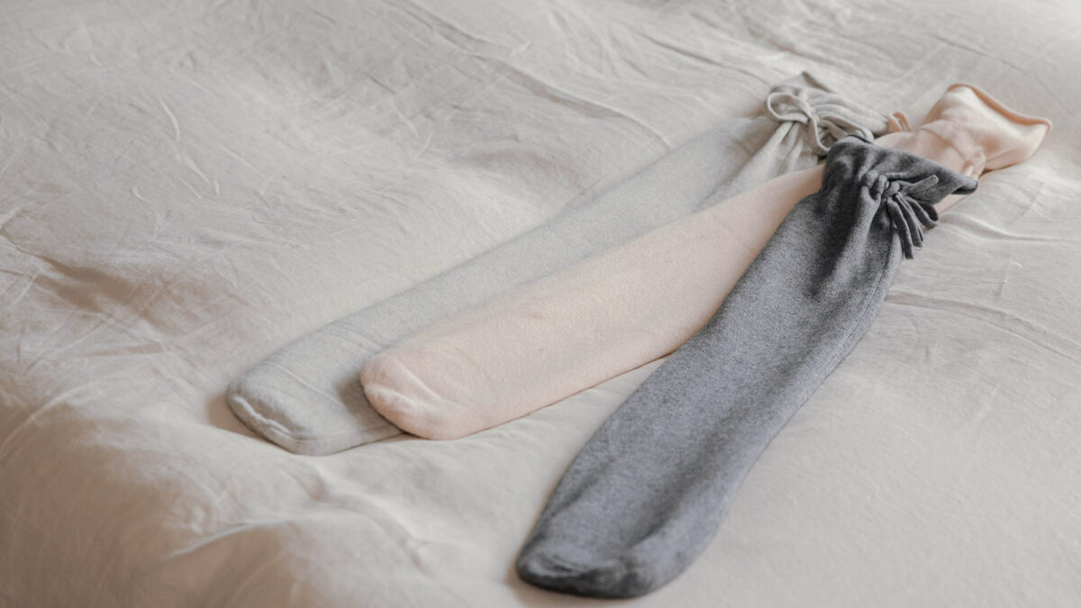 long hot water bottles with soft knitted covers