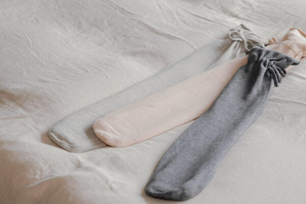 long hot water bottles with soft knitted covers