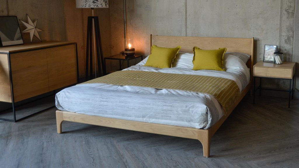 Carnaby a low mid-century style bed great for bedrooms with low ceilings, here it is made from solid Oak.