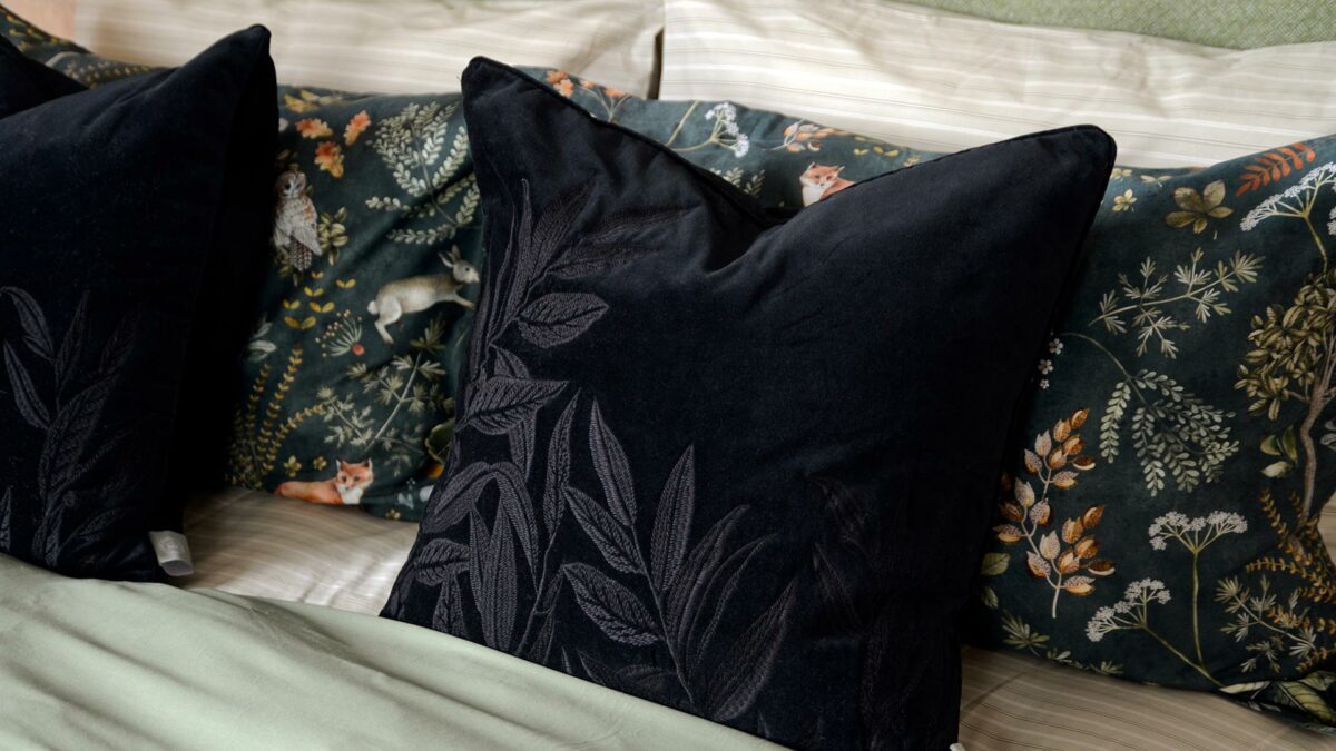 luxurious black velvet cushion with leaf embroidery