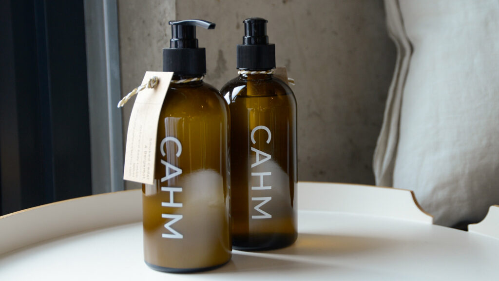 Luxury Hand and Body care liquid soap and lotion set in amber dispensing bottles by Cahm