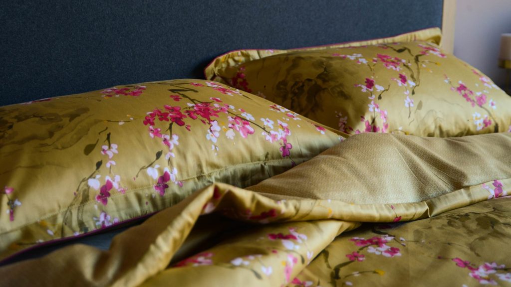 gold and pink cherry blossom print bedding