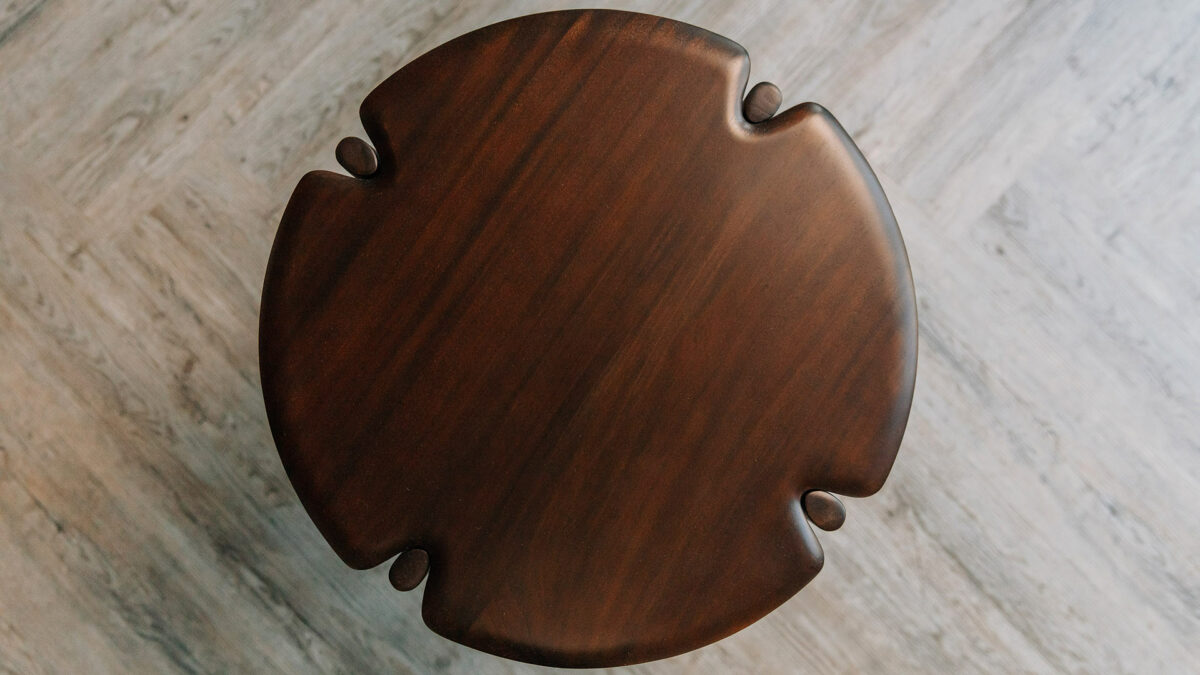 sculptural mid century style dark mahogany side table shown from the top