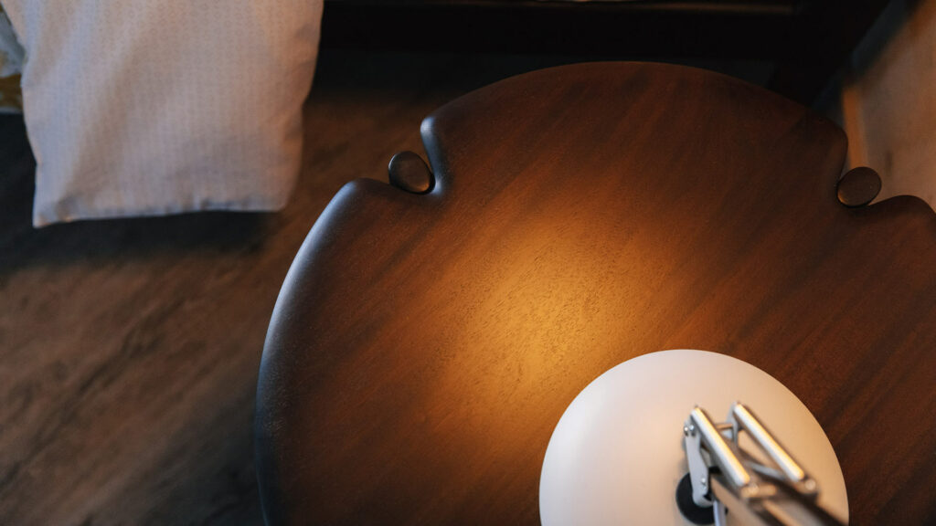 sculptural mid century style dark mahogany side table shown from the top