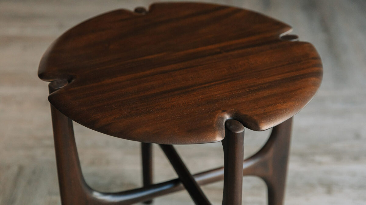 sculptural mid century style dark mahogany side table shown from the top