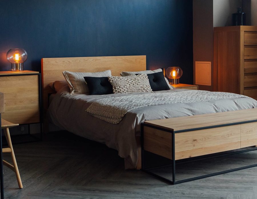 Our hand made Malabar bed in Oak shown with Ethnicraft Monolit storage furniture