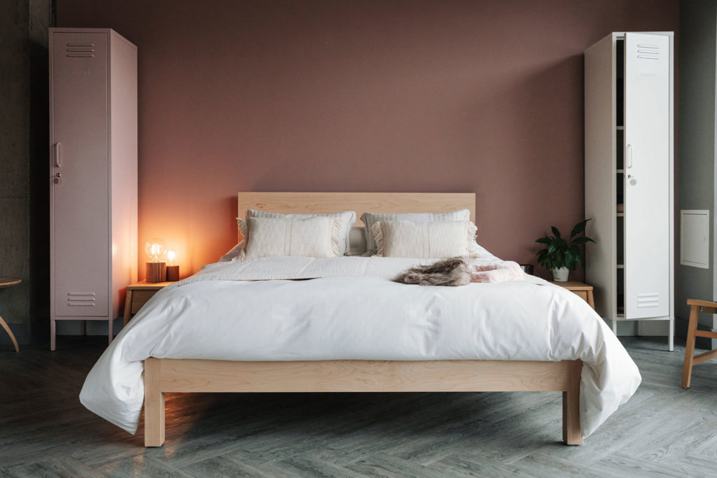 Andas throw and cushions on the Malabar contemporary wooden bed shown in Maple