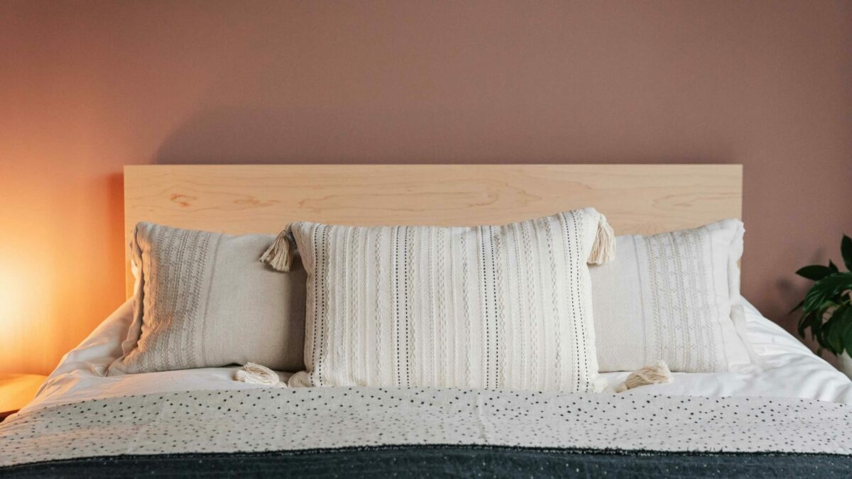 ivory embroidered cushion with tassels