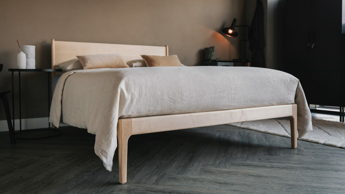 maple Camden bed with round Ethnicraft side tables