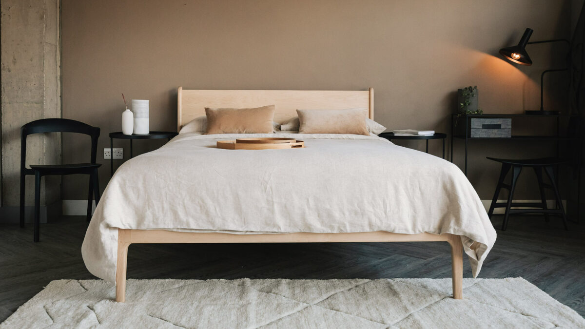 neutral bedroom scheme with solid maple Camden bed, pale stone coloured bedding and black accessories