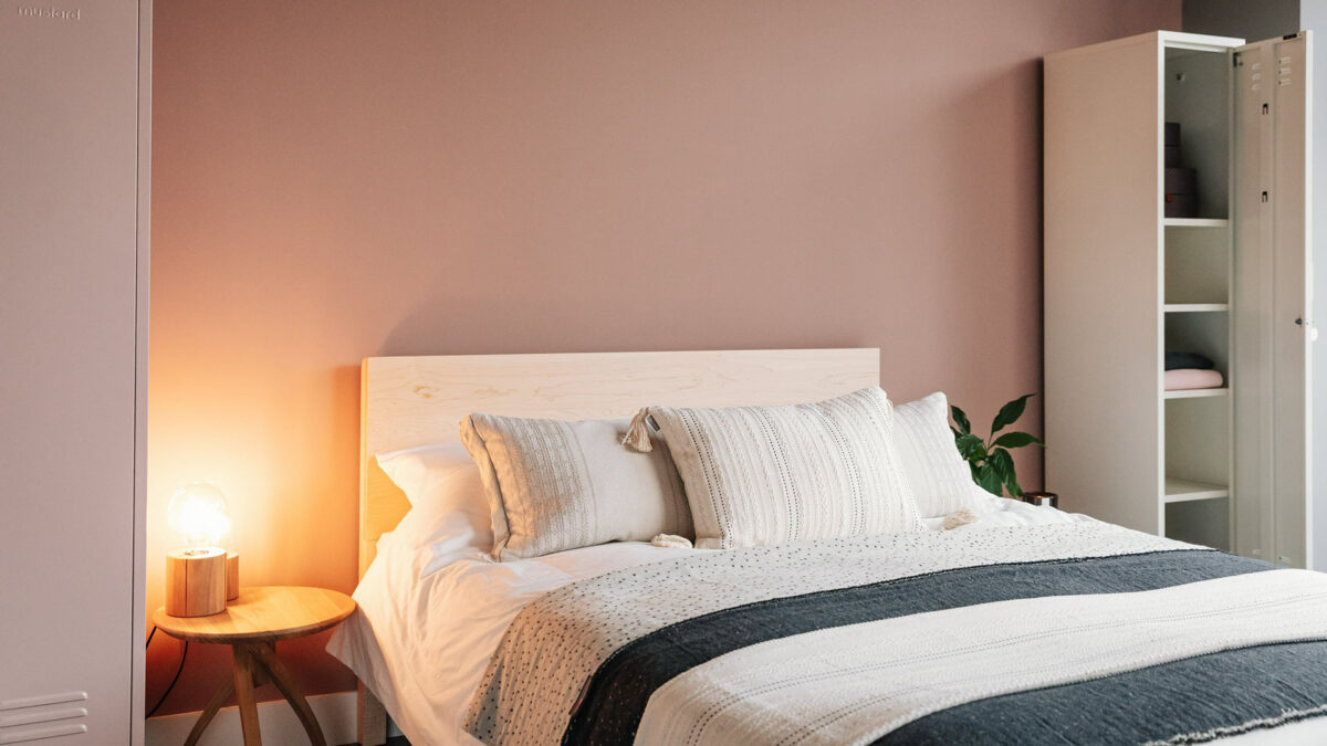 Blush pink bedroom with Maple Malabar solid wooden bed