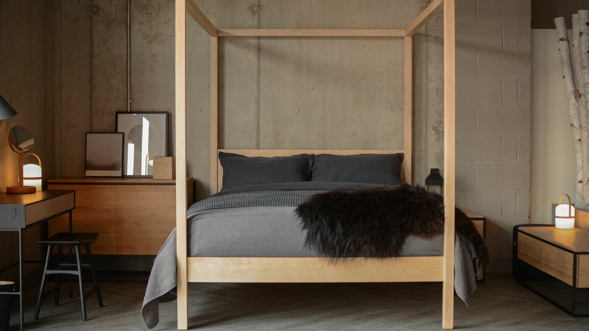 A monochrome colour scheme and pale maple wood Orchid 4 poster bed give this room a Scandi look