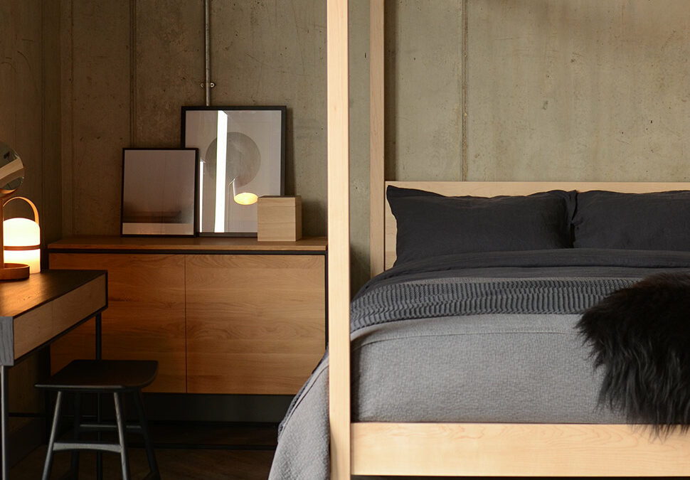 Dark accents and natural timbers for a Scandinavian style bedroom featuring our wooden 4 poster Orchid bed