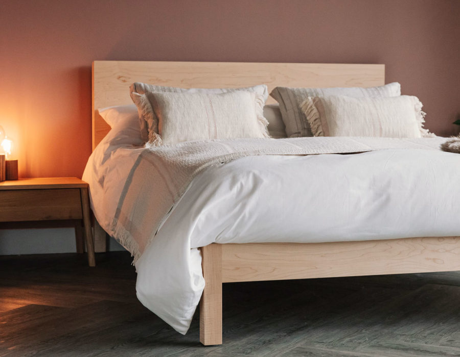 maple wood bed with oak bedside AIR table and Andas throw and cushions