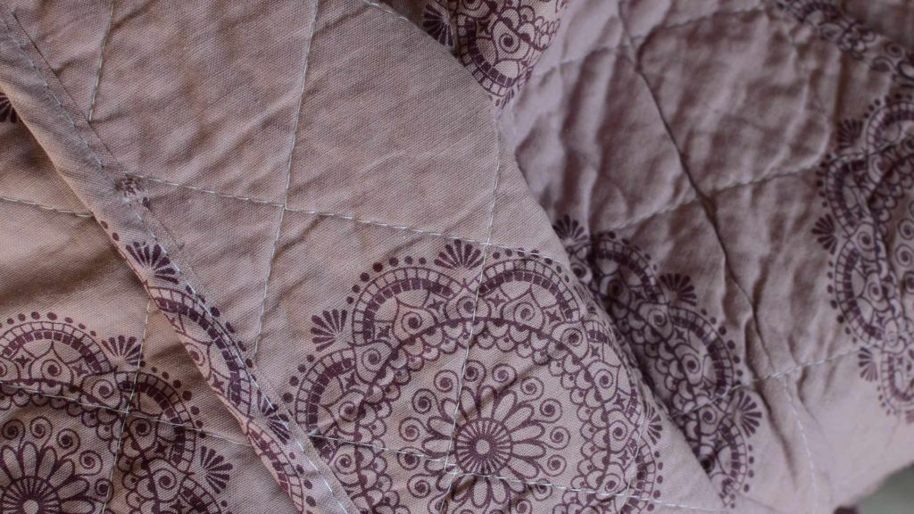 mauve-printed-cotton-quilted-throw