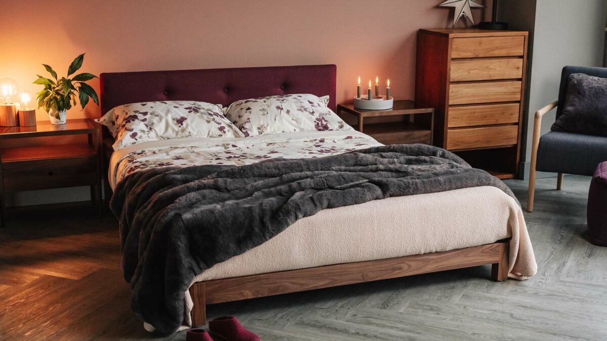 Walnut version of our low wooden Iona bed - upholstery in Amatheon Emperor