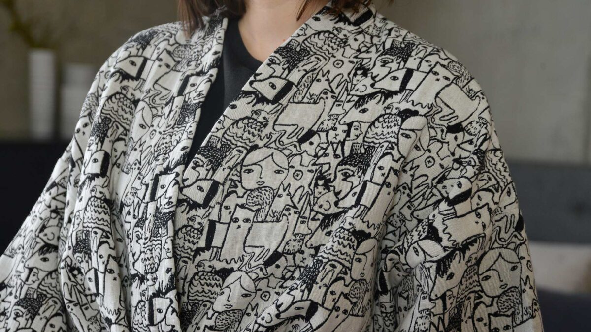 Donna Wilson black and white woven characters design robe, a close up view