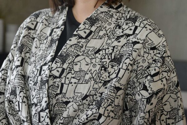 Donna Wilson black and white woven characters design robe, a close up view