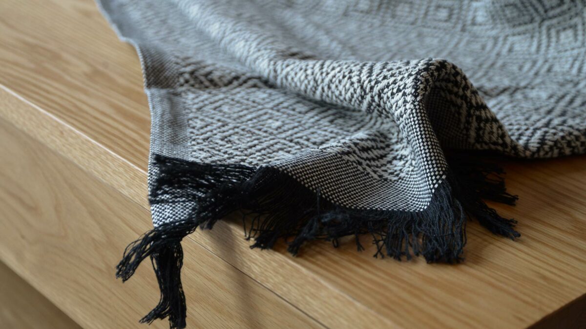 cotton rich woven diamond pattern throw in black and white