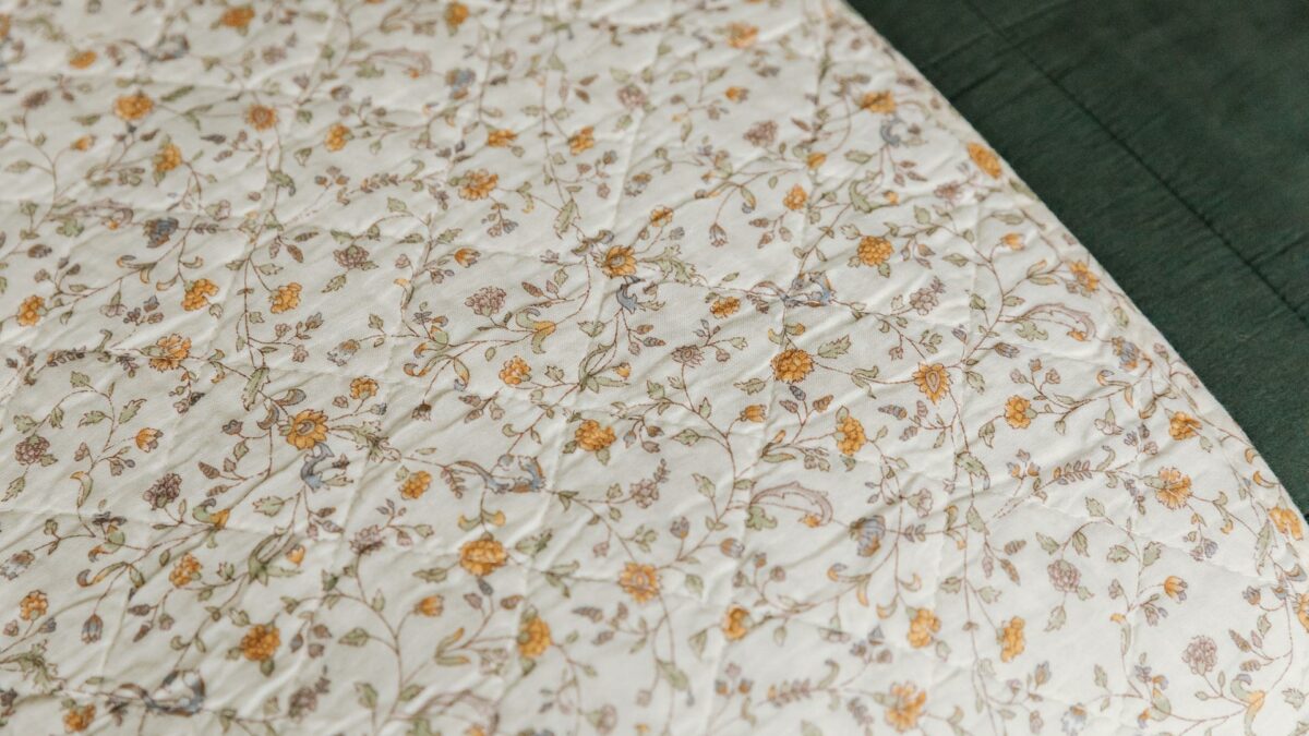 floral print cotton quilted throw shown close up