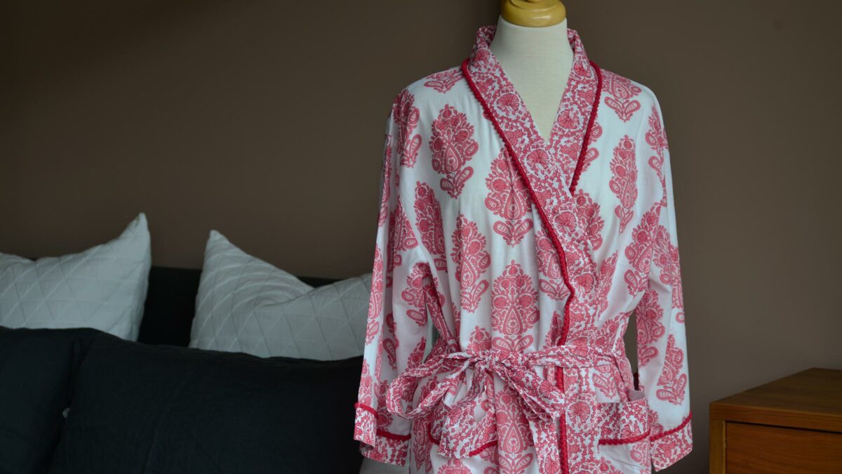 block print design cotton robe in pink and white with pom-pom trim