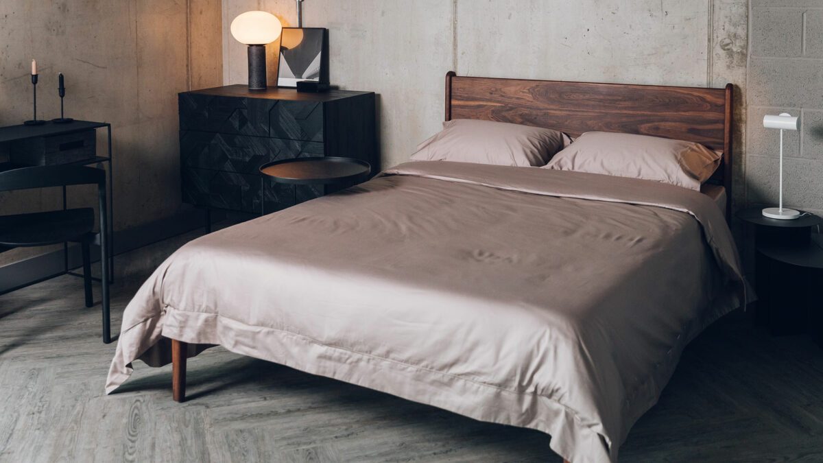 monochrome bedroom look using taupe bedding a deep solid walnut Camden bed and black furniture