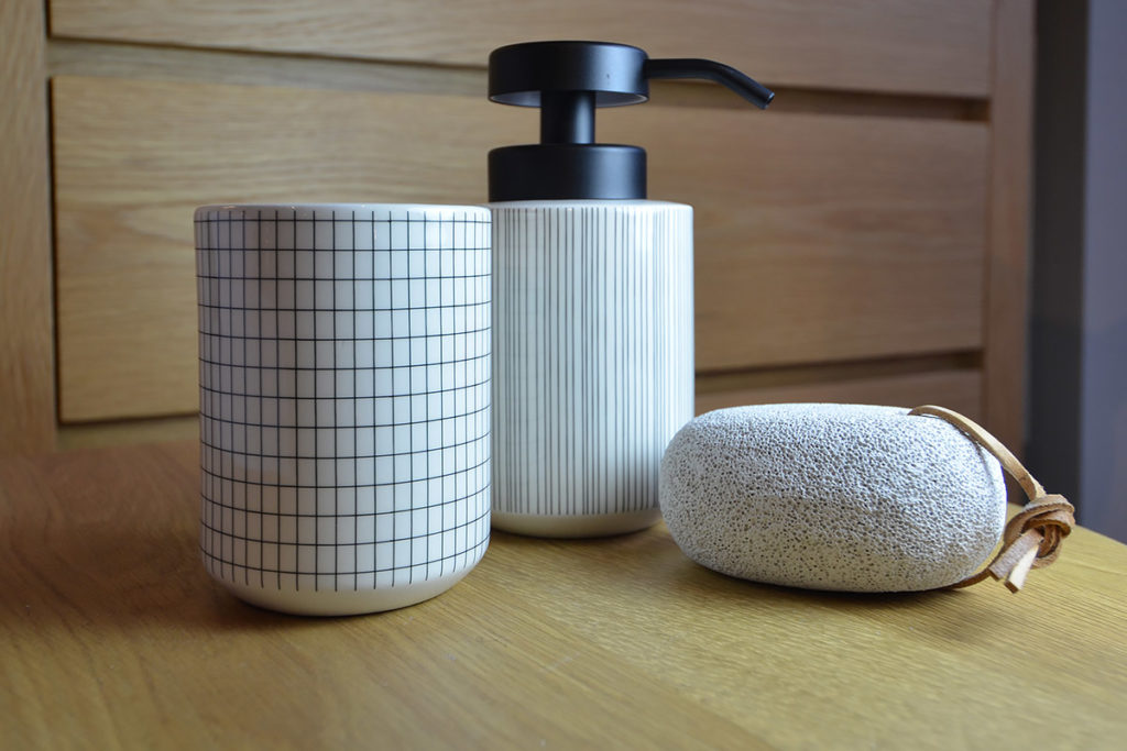 modern bathroom accessories available from Natural Bed Company. Including the grid-pattern tumbler and striped soap dispenser.