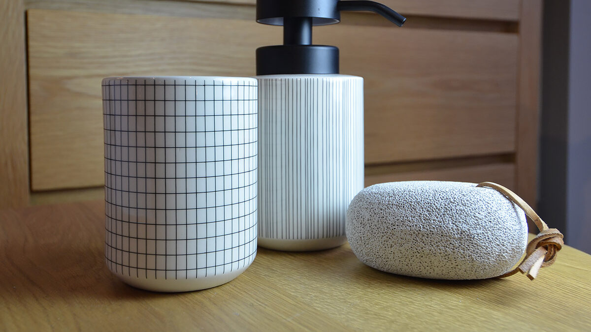 modern bathroom accessories available from Natural Bed Company. Including the grid-pattern tumbler and striped soap dispenser.