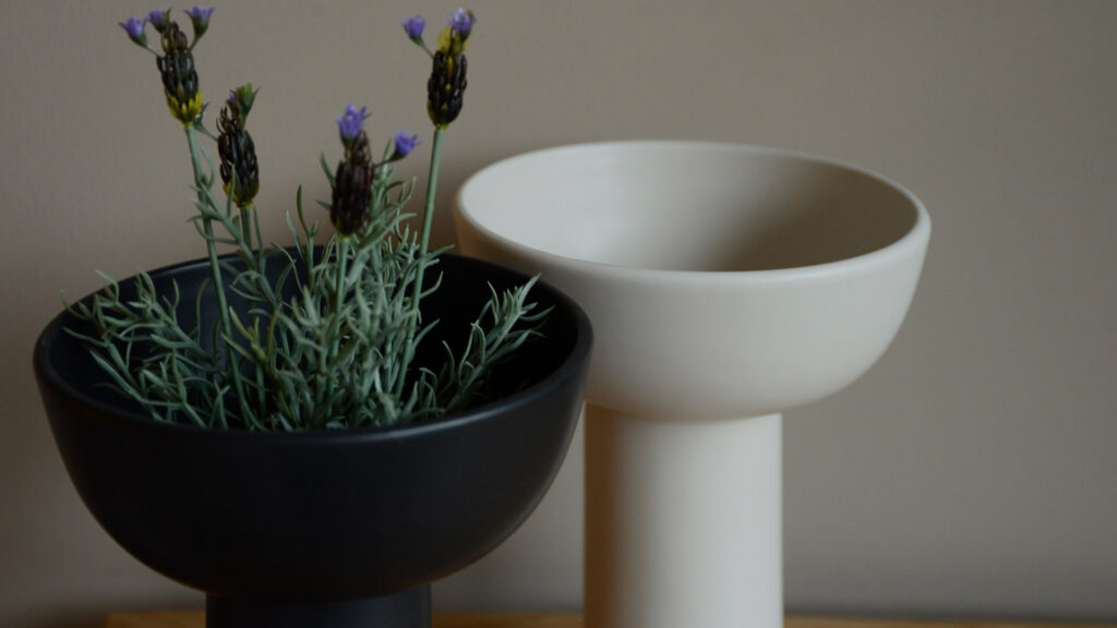 modern ceramic vases in ivory and black