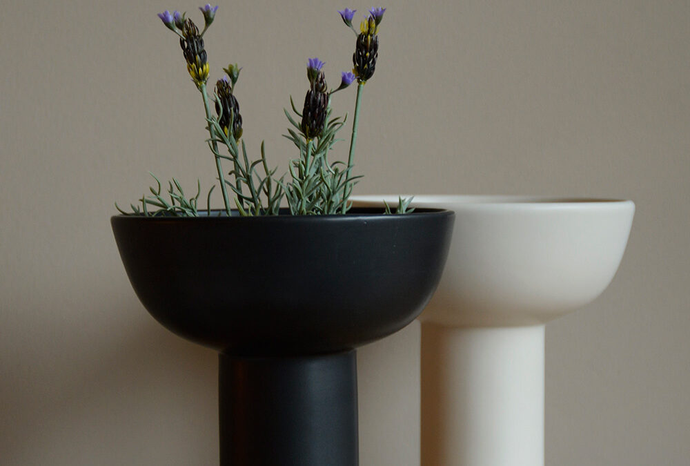 modern ceramic vases in ivory and black