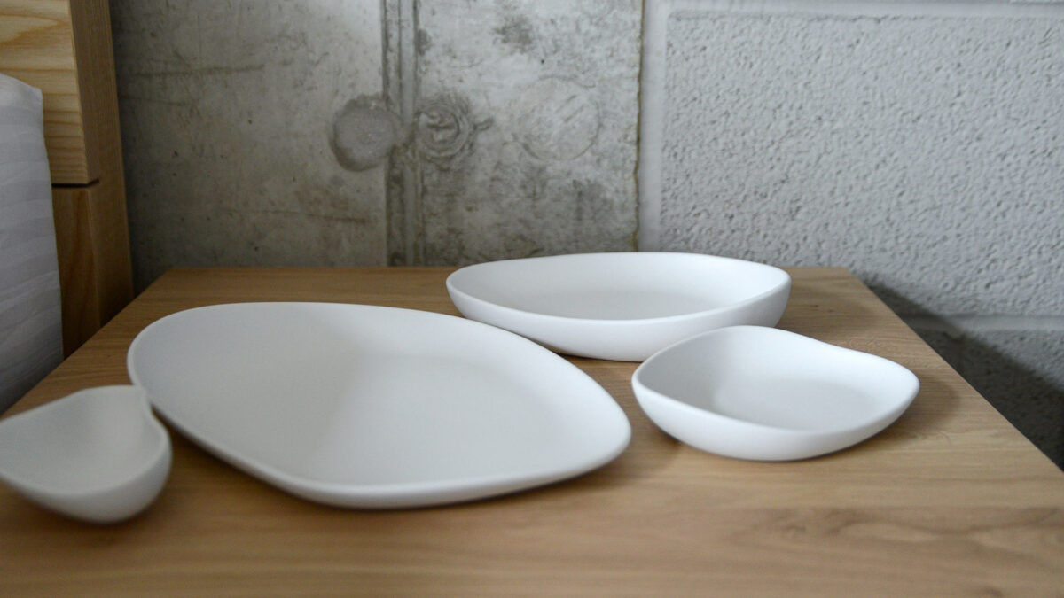 a set of matte white porcelain dishes