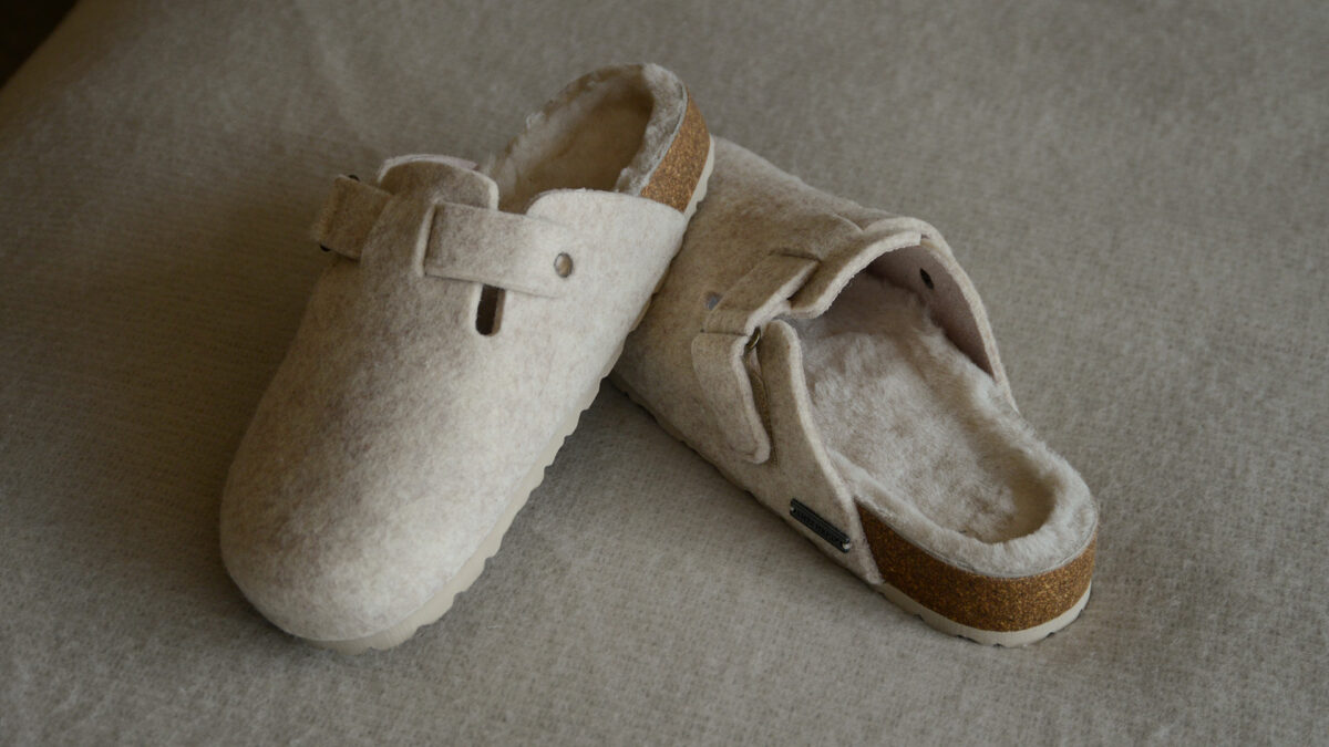 Felted wool clog style slippers in pale beige with sheepskin inners