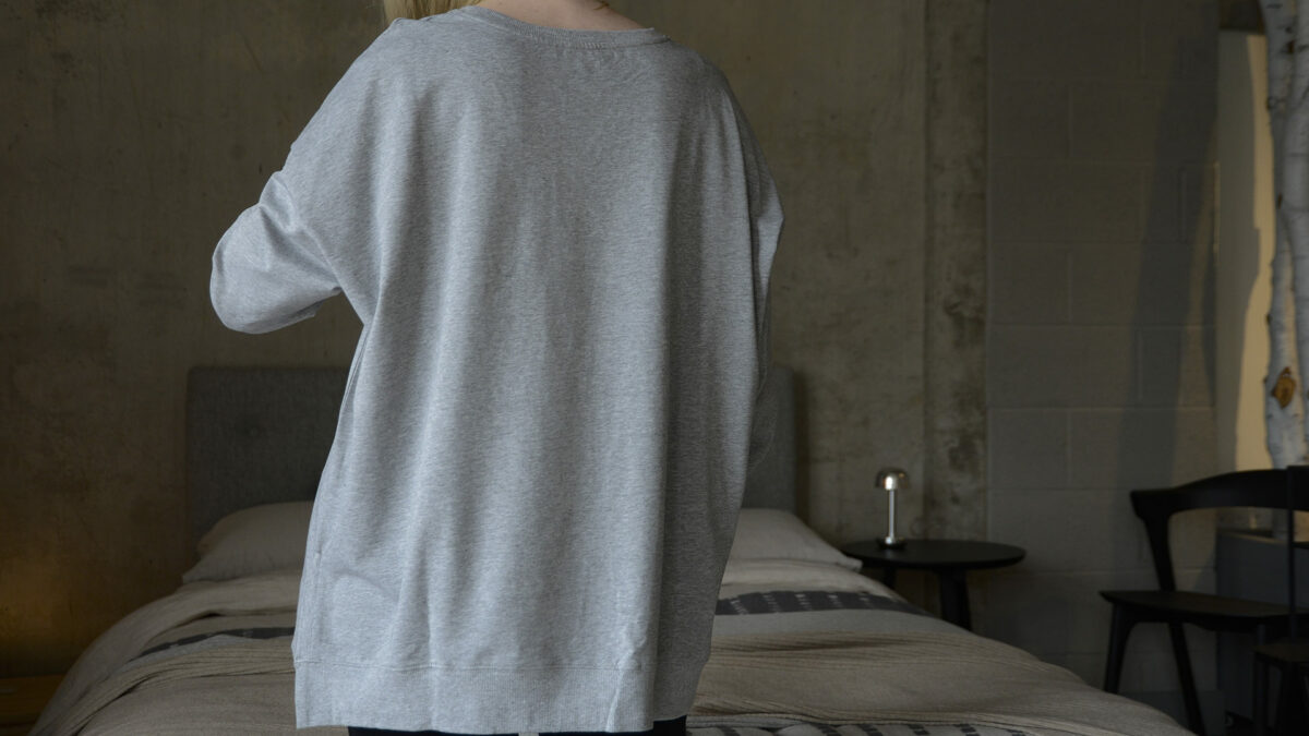 loose fit long sleeve sweatshirt in grey marl from the back