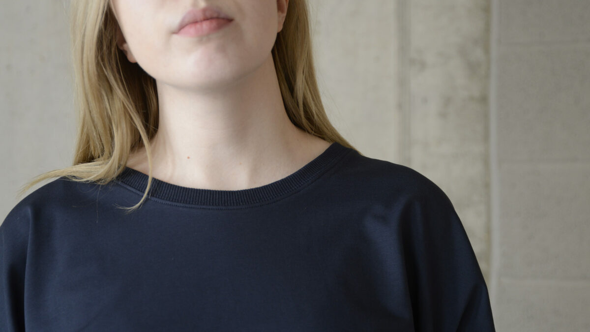 loose fit long sleeve sweatshirt in navy a close up of the neckline