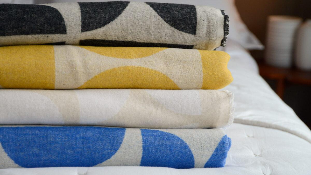 graphic patterned soft cotton throws in a choice of colours