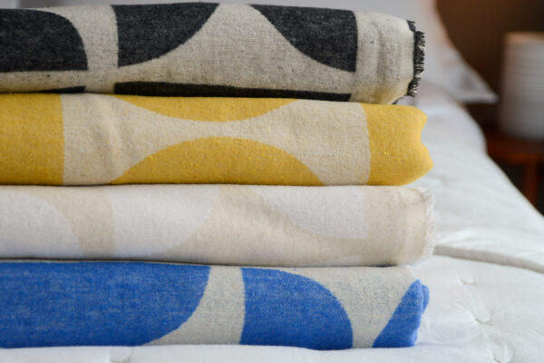 graphic patterned soft cotton throws in a choice of colours