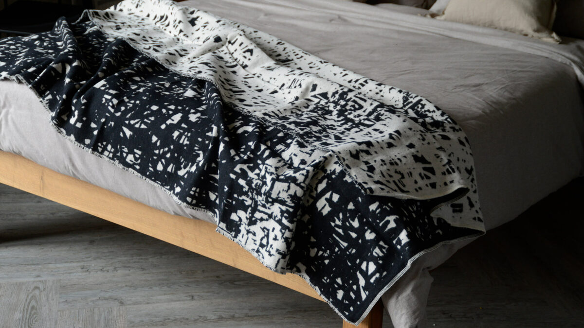 soft recycled cotton reversible throw in black and ivory