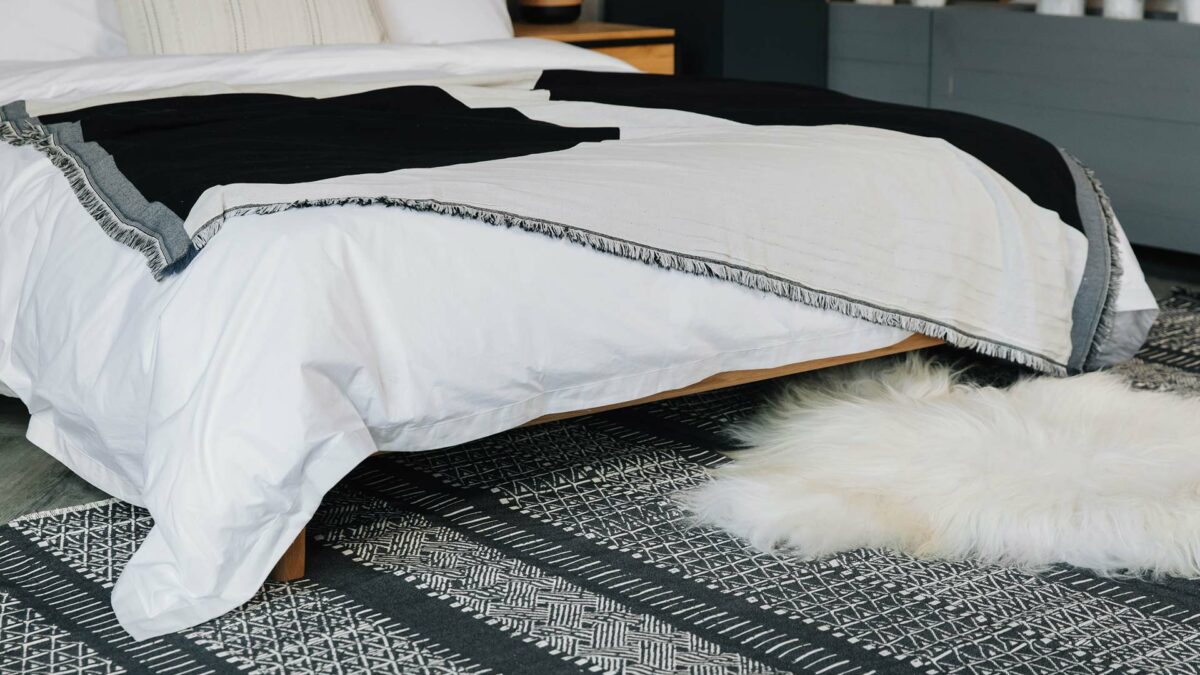 monochrome bedding with reversible rug