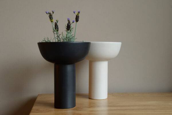 modern ceramic vases in ivory and black