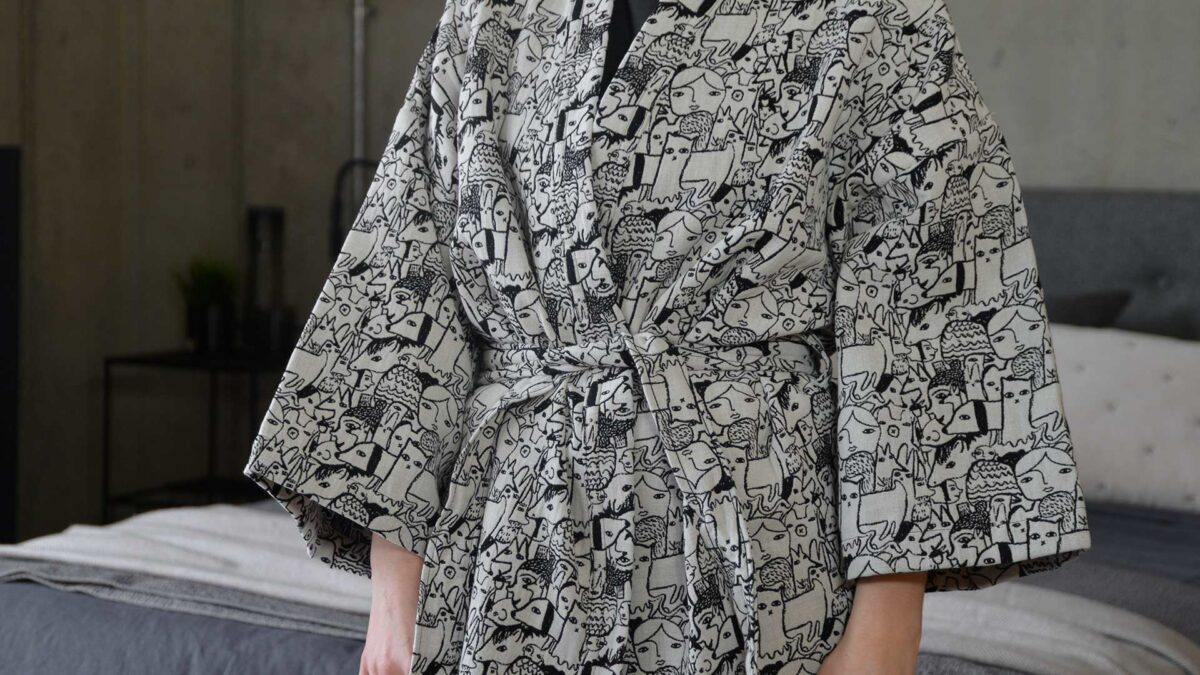 donna Wilson black and white woven characters design robe, a close up view