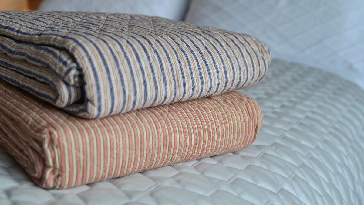 multicolour striped quilted throw
