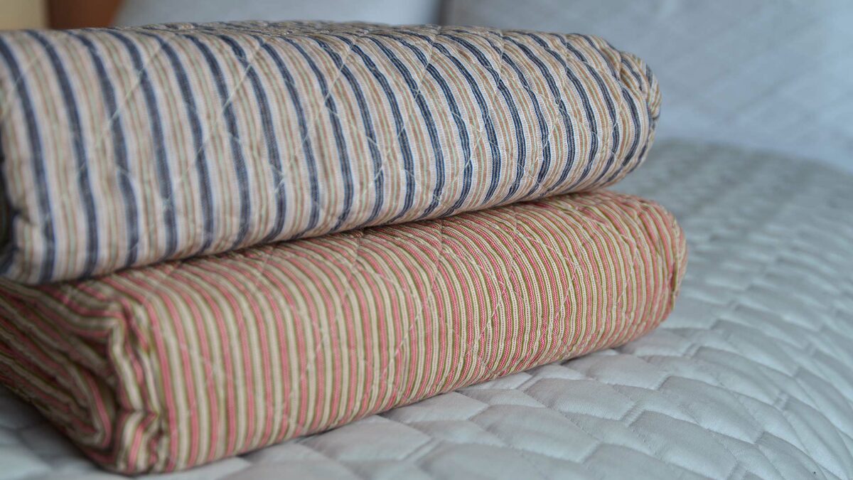 multicolour striped quilted throw